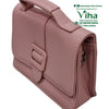 Trendy & Stylish Sling Bag For Ladies, pink handbag featuring a top handle and a central buckle strap closure