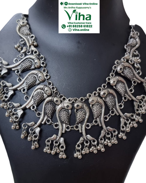 White Metal Oxidised Peacock Necklace with bird motifs and hanging bell accents