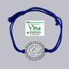 White Metal Rakhi, a grey-toned circular metal pendant with an ornate heart-cutout border and a central symbol, threaded onto a dark blue string