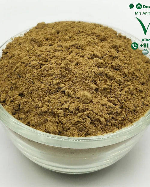 Amla Powder, a clear glass round bowl containing a mound of fine brown powder with a matte finish
