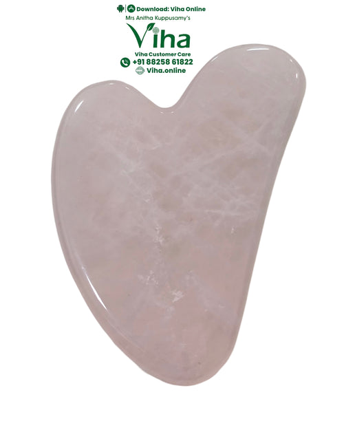 Rose Quartz Guasha, a polished, pale pink, heart-shaped stone scraper featuring one flat surface with visible internal fractures and rounded edges