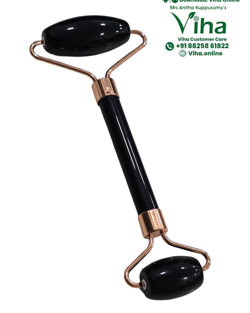Black Tourmaline Face Roller, a glossy black roller with two round stones and copper-toned metal joints framing a central handle