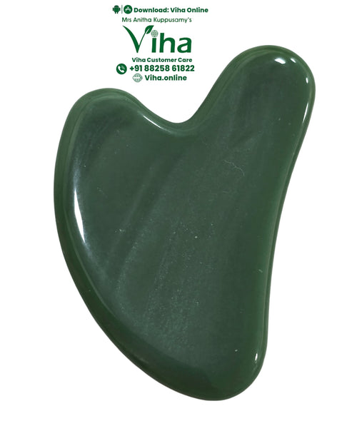 Green Jade Guasha, one glossy, heart-shaped, dark-green stone tool with smooth curved edges and an asymmetrical indentation at the top