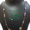 Trendy Crystal Chain Set, a gold-toned chain necklace with ten mixed-shape beads and two matching drop earrings displayed on a black stand