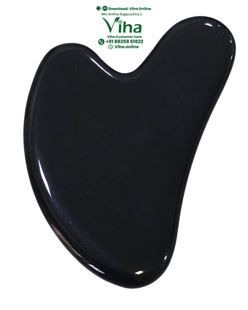 Black Tourmaline Guasha, a black heart-shaped smooth object with a glossy finish