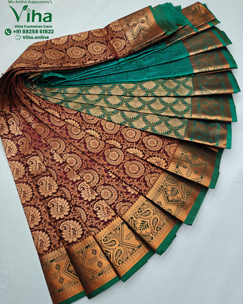 Semi Silk Saree, maroon and green fabric draped with gold-toned patterned borders and intricate motifs