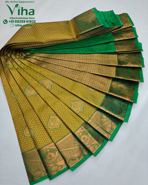 Semi Silk Saree, a pleated green fabric features intricate gold-toned woven patterns with recurring paisley and geometric motifs throughout its shiny surface