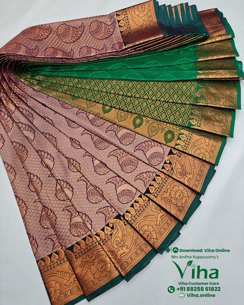 Semi Silk Saree, a folded pink and green fabric featuring gold-toned paisley motifs and ornate borders arranged symmetrically against a white background