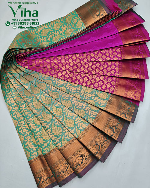 Semi Silk Saree, a fan-fold of patterned textiles in green, magenta and gold-toned hues featuring floral motifs and borders