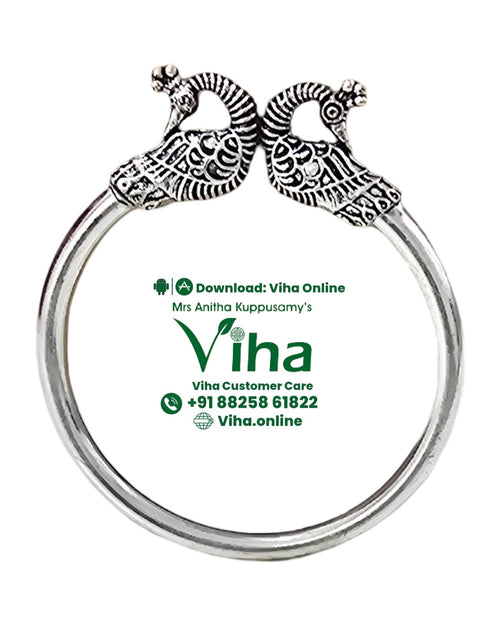 White Metal Bracelet with bird-shaped terminals and engraved patterns