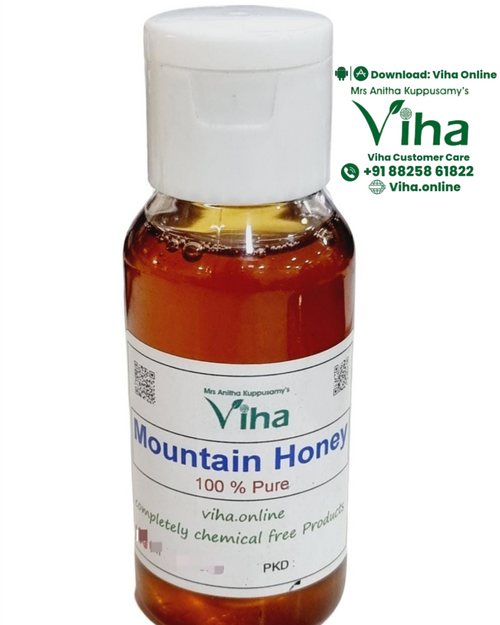 Mountain Honey in a clear plastic bottle with amber liquid inside