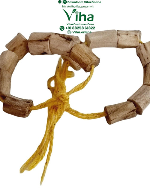 Vasambu Bracelet, two pale wood bead bracelets tied with yellow thread