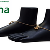 Impon Kolusu, gold-toned anklets with a hanging ball charm worn on mannequin feet