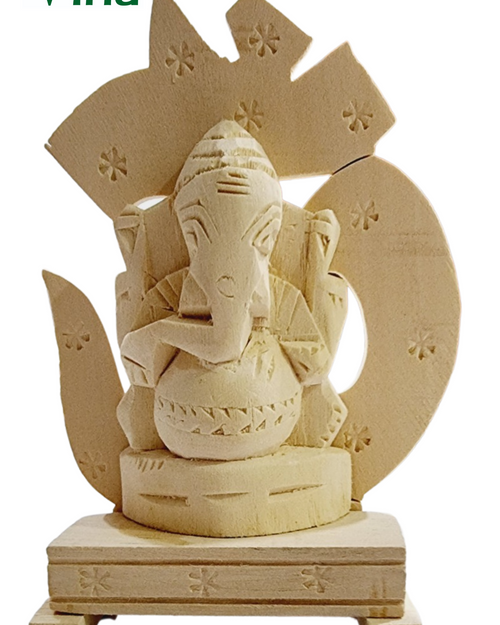Vellerukku Vinayagar / Shwetark, a light-tan wooden carving featuring a seated figure before a symbol etched with eleven star motifs
