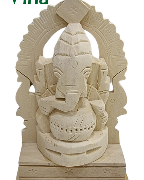 Vellerukku Vinayagar, a beige carved wooden figurine with matte finish featuring a seated figure with an elephant head before an ornate, arched backdrop