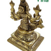 Varahi Amman Statue, a gold-toned metallic figurine with four arms viewed from behind, seated on a square tiered base with engraved petal motifs