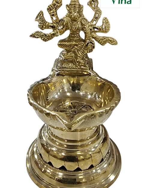 Varahi Amman lamp in brass, Varahi figure above a five-point oil well on a tall ringed pedestal