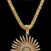 Impon Pendant Chain, a gold-toned chain with a sunburst-shaped pendant set with clear, red, and green stones
