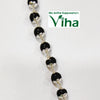 Karungali Bracelet Silver with Cappings, twelve black round beads capped in silver-toned metal on a thin chain with clasps