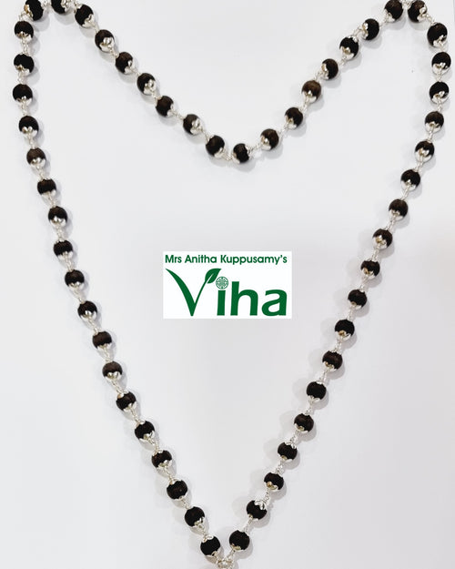 Karungali Silver Mala with Cappings 54+1 Beads, a long necklace of dark brown textured spheres capped in silver-toned filigree connected by wire