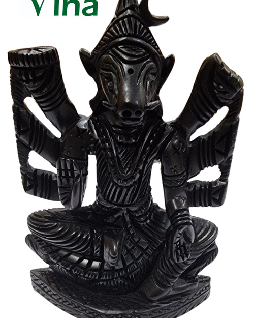 Karungali Varahi Amman, multi-armed figure with an animal head seated on a lotus, carved in black karungali wood