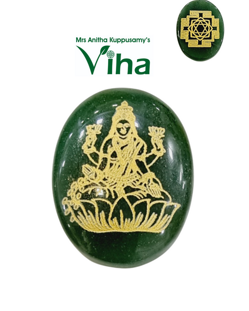 Mahalakshmi Sri Yantra Jade Coin, an oval green stone featuring a glossy surface finish, with gold-toned engraved figure and geometric pattern details