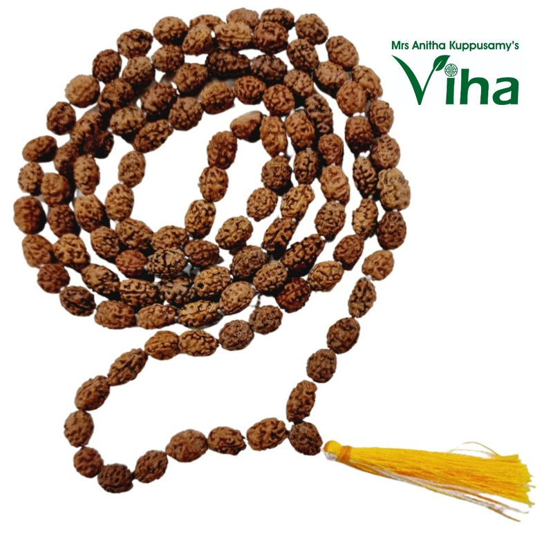 Face Rudraksh Mala, a long loop of many textured brown seed-like beads ending in a yellow tassel