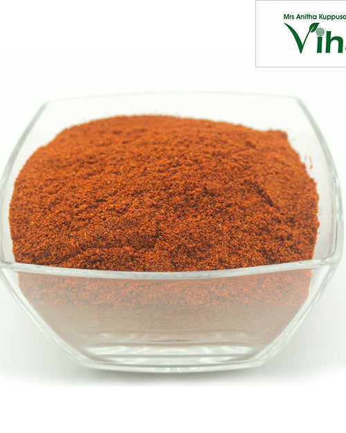 Red Chilli Powder in a transparent square glass bowl