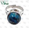 Turquoise Ring Silver Adjustable, a silver-toned adjustable ring featuring a round blue-and-black speckled stone with a glossy finish
