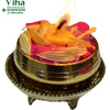 Jaladeepam Lamp, a gold-toned, stepped, footed vessel holding a yellow-orange flame, pink petals, and pale yellow petals