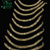 Impon Unisex Bracelet, nine gold-toned curved metal chains of varying lengths with textured links are arranged vertically on a black background