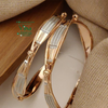 Designer Bangle, a hinged band dotted with small round beads
