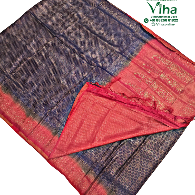 Designer Soft Silk Saree with Blouse, a folded textile featuring a dark blue section patterned with gold-toned motifs and a red border with paisley designs