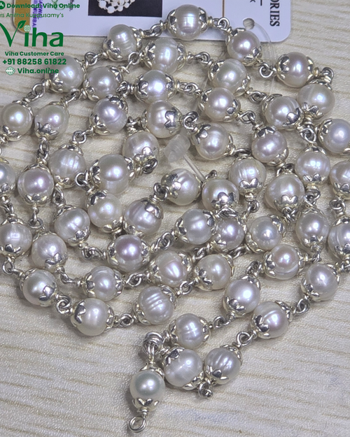 Pearl Silver Mala, a long strand of white pearl beads with silver scalloped caps