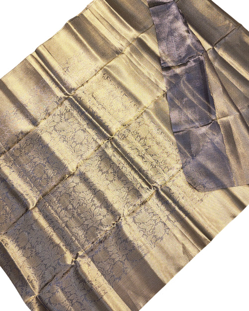 Banarasi Silk Saree With Blouse, a shiny gold-toned and grey pleated textile with intricate woven floral patterns