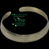 Metal Necklace, a metallic open-ended cuff with a hammered texture, featuring a polished finish and rounded ends