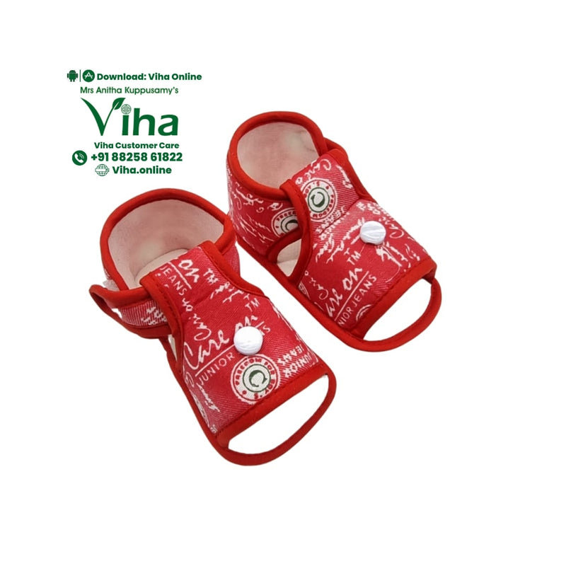 Baby Booties Adjustable 3 to 12 months, a pair of red patterned baby booties featuring white text print and a single white button closure on each