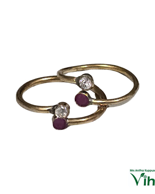 Impon Metti with open ends and round stones