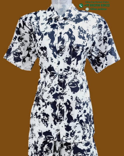 Shirt With Shorts, a white short-sleeved collared shirt and shorts set featuring an abstract dark blue pattern, displayed on a translucent mannequin torso