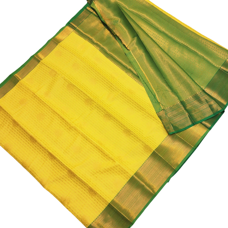 Semi Soft Silk Saree With Blouse, a yellow textile featuring green borders and gold-toned woven patterns