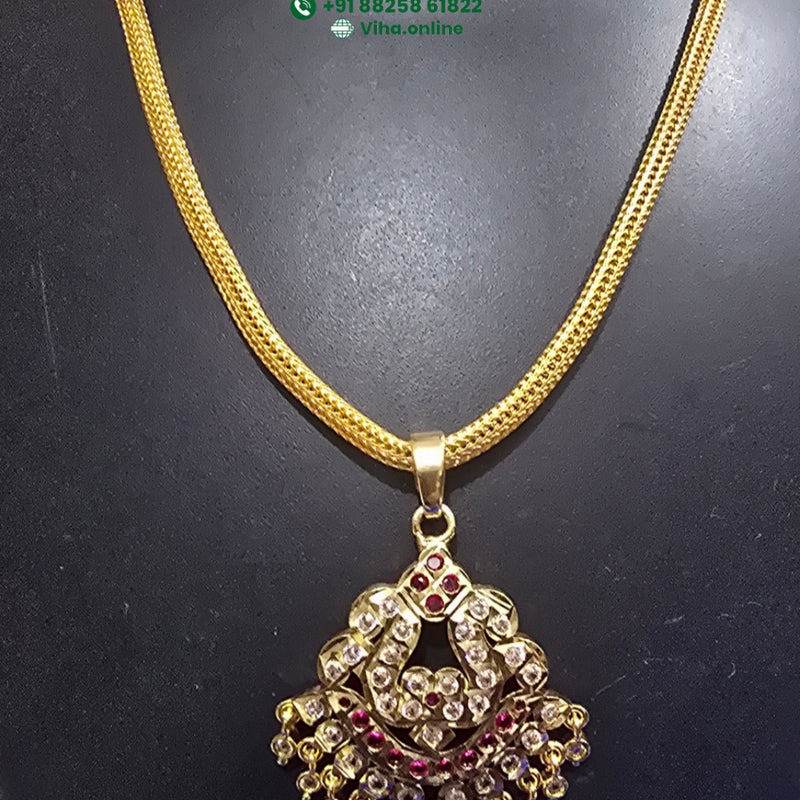 Impon Attiyal with a decorative pendant and hanging elements