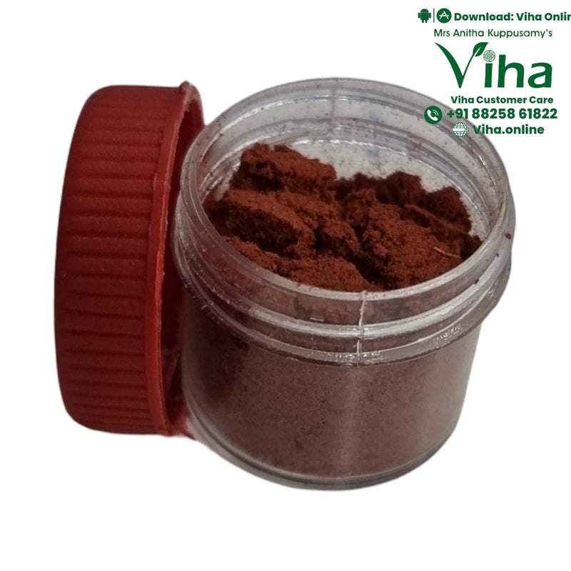 Javadhu Powder, a small clear jar of brown powder beside its ribbed red cap