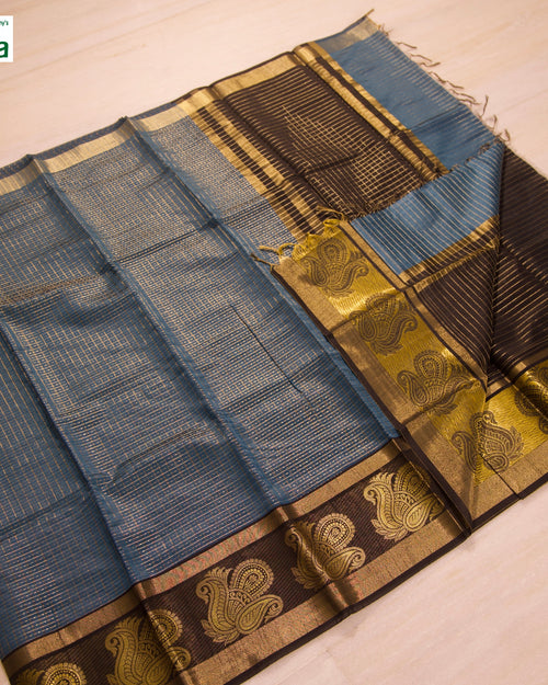 Premium Cotton Silk Saree With Blouse, a blue and brown folded textile featuring gold-toned borders with repeating motifs