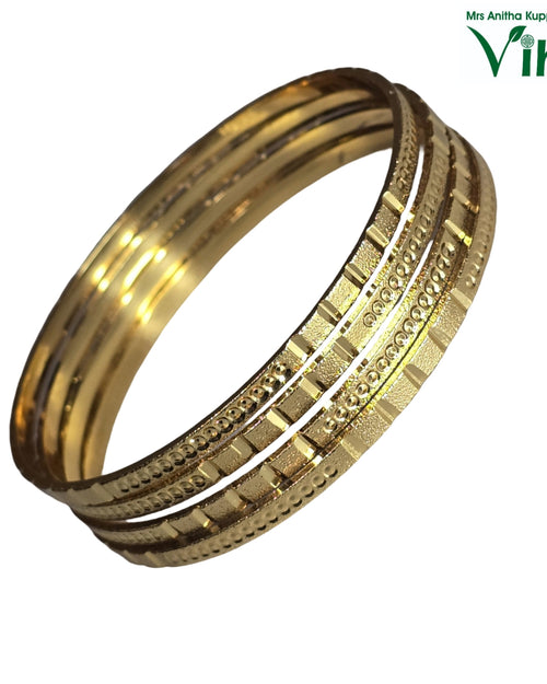 Impon Bangle with nested bands and ridged patterns