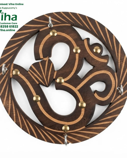 Wooden Om Key Holder, a round brown wooden plaque with eight gold-toned studs, four silver-toned rings and pale engraved lines
