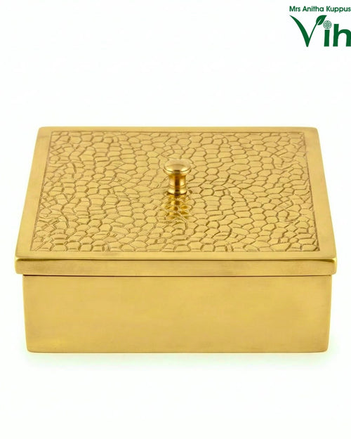 Spice Box - Brass, a gold-toned rectangular box with smooth sides and a lid featuring a textured pattern and a central knob