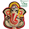 Vettiver Vinayagar, a fibrous brown figurine with red, green, and yellow accents, featuring a clear-stone garland and painted facial details
