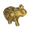 Elephant in brass, standing with the trunk raised and curled over the head, body engraved with floral patterns