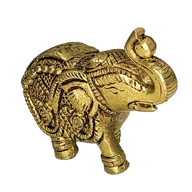 Elephant in brass, standing with the trunk raised and curled over the head, body engraved with floral patterns