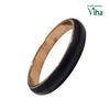 karungali Copper Bangle, a glossy black ring with a shiny copper-toned interior band surface
